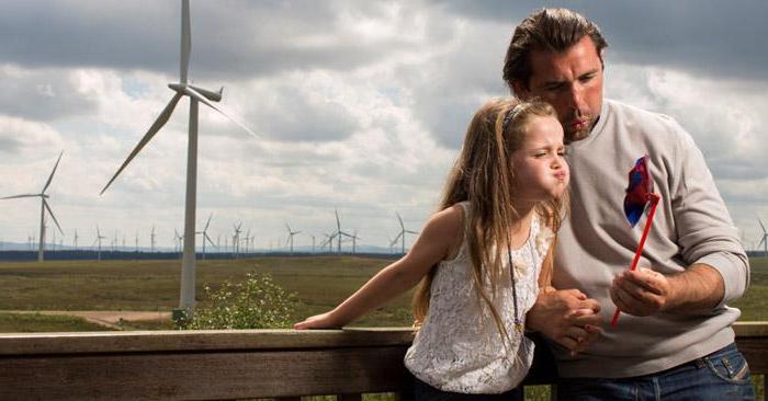 Photo of a father and daughter at Whitelee windfarm